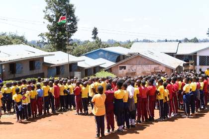 A large group of learners gathered for assembly.
