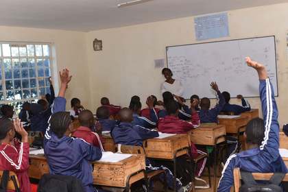 Learners raising their hands to answer a question.