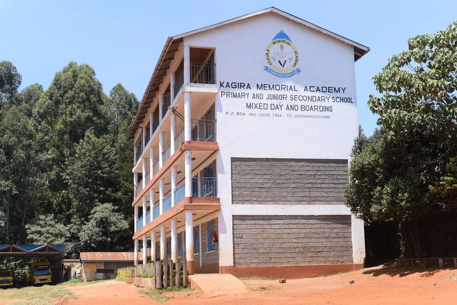 The Kagira Memorial Academy administration block, bearing the school crest and name.