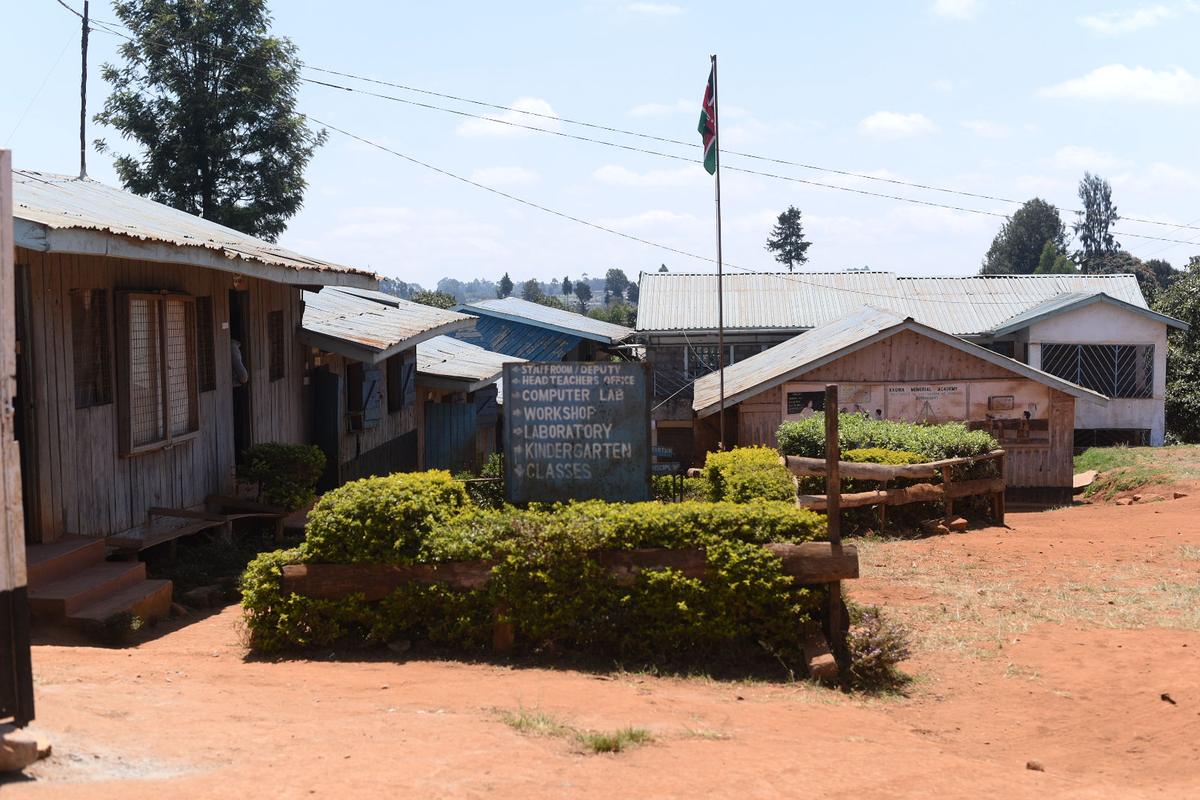 The pathway and signage inside Kagira Memorial Academy's campus.