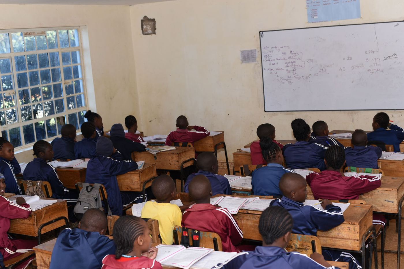 Learners at their desks during a lesson at Kagira Memorial Academy.
