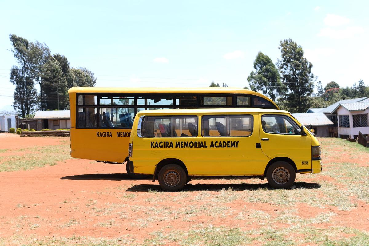 One of Kagira Memorial Academy's school buses parked on the campus grounds.