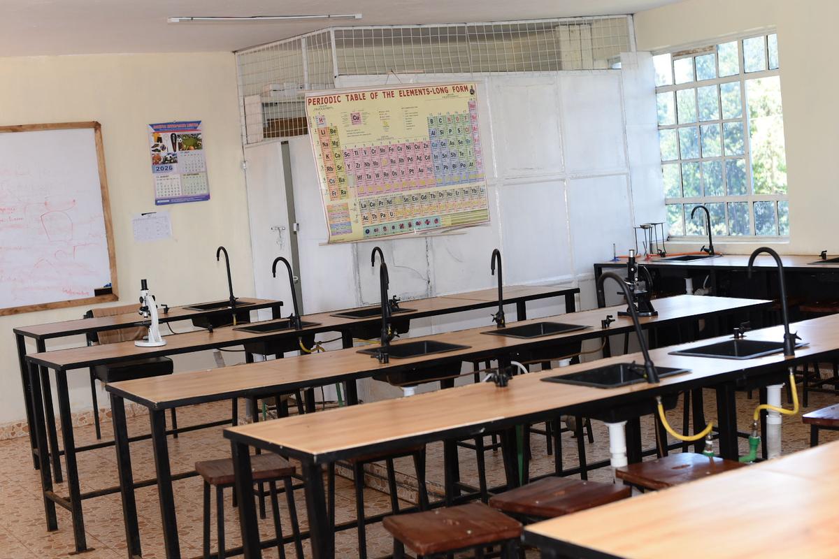 The science laboratory at Kagira Memorial Academy, with individual workbenches and sinks.